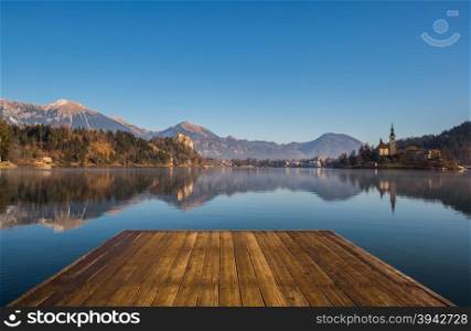 A wooden dock, pier, on a lake in autumn