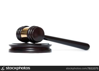 A wooden judge gavel and soundboard isolated on white background