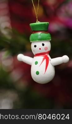 A wooden snowman to decorate a christmas tree