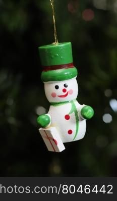 A wooden snowman to decorate a christmas tree