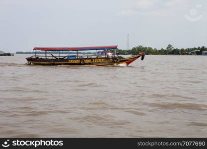 A wooden tourist boat on Can Tho River, Mekong Delta, southern Vietnam.