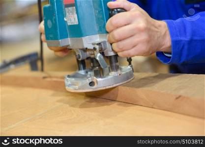 a worker polishing a wood