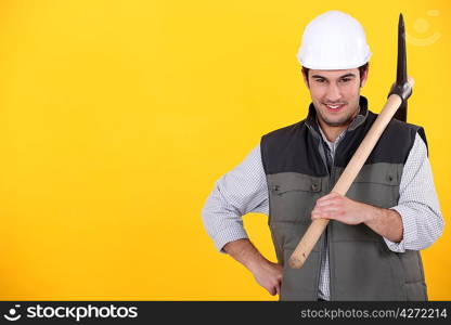 a worker posing with a pickaxe