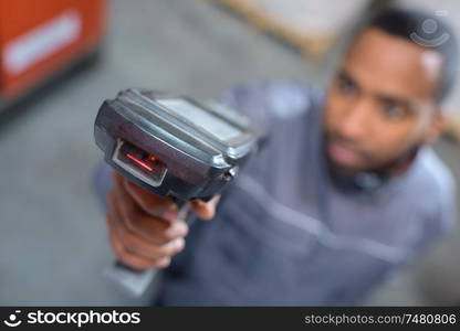 a worker scanning a package