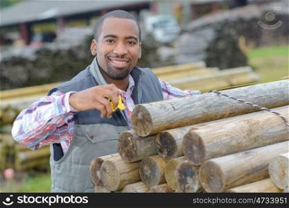 a worker securing the timber