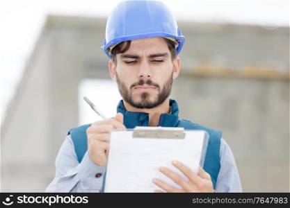 a workman with a clipboard