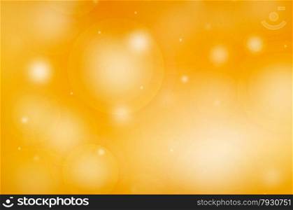 A yellow and gold bokeh background with white flares