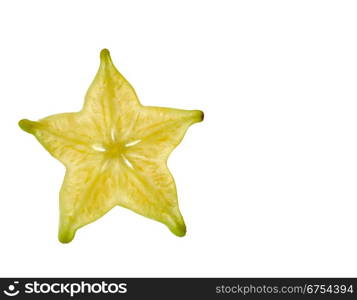 A yellow carambola slice photographed from close using light from the back to highlight the details. Carambola Slice