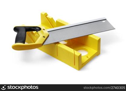 A yellow miter box and a backsaw on white