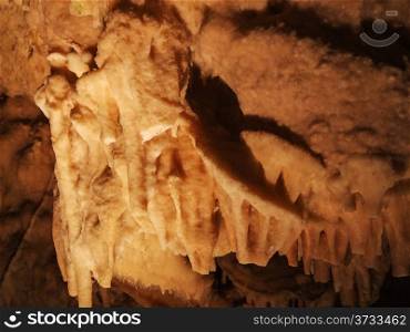 A yellow orange stalagmite in the cave