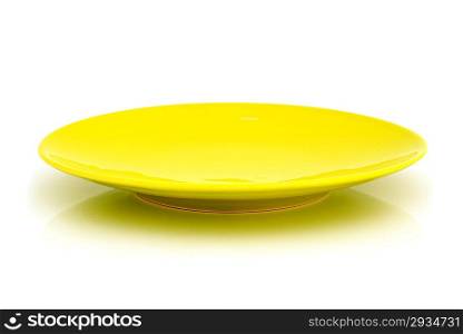 A yellow saucer on the white background