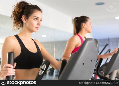 A young and beautiful woman working out at the gym