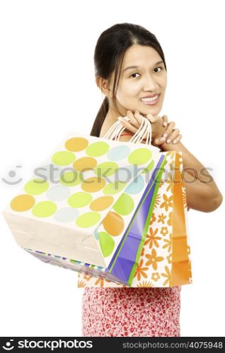 A young and pretty woman carrying shopping bags