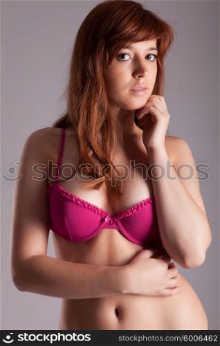a young and very sexy woman posing in lingerie