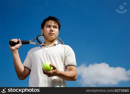 A young asian male tennis player outdoor
