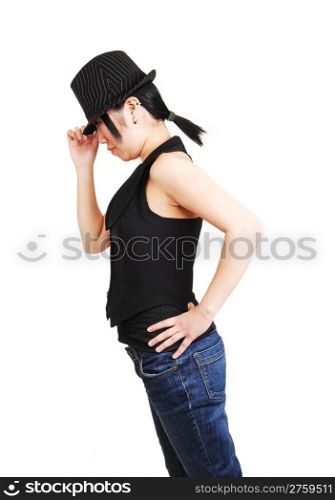 A young Asian woman with an back hat and west und jeans with short blackhair, leaning forward and holding her hat, for white background.