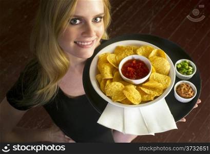A Young Attractive Female Server Brings Appetizer Food Tray