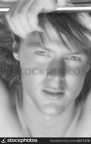 A young Australian man poses in studio. .