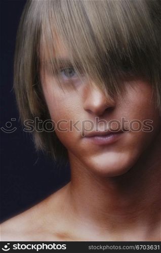 A young Australian man poses in studio. .