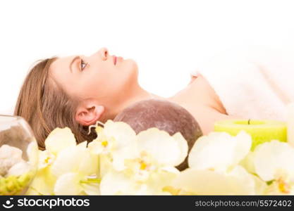 A young beautiful woman relaxing at a spa (wellness concept)