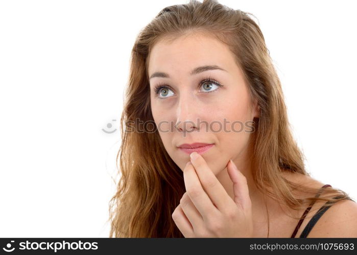 a young beautiful woman thinking looking to the side, on white