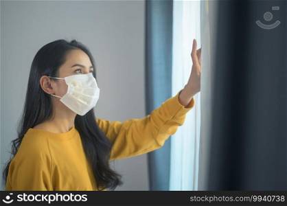 A young beautiful woman wearing a protective facial mask getting ready to go outside, Healthcare and covid-19 concept  . Young beautiful woman wearing a protective facial mask getting ready to go outside, Healthcare and covid-19 concept  