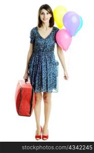 A young beautiful woman with balloons and a bag