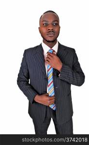A young black business man standing in a suit and tie, fixing his tiefor white background.