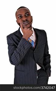 A young black business man standing in a suit and tie with his handon his chin and thinking hard, for white background.