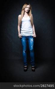 a young blonde wearing jeans and jacket full body