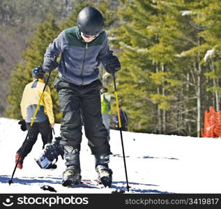 A young boy getting ready to ski.
