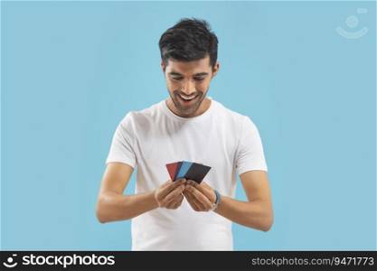 A young boy looking at his credit cards.
