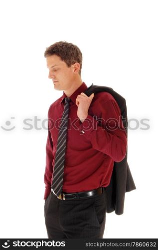 A young business man in a burgundy shirt and tie with his jacket overhis shoulder, standing isolated for white background.