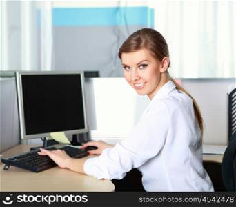 a young business woman at her workplace in the office