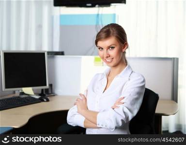 a young business woman at her workplace in the office