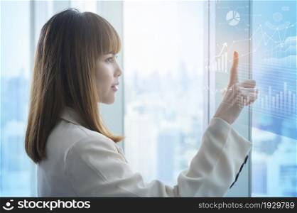 A young business woman hand touching on virtual screen. Young business woman hand touching on virtual screen