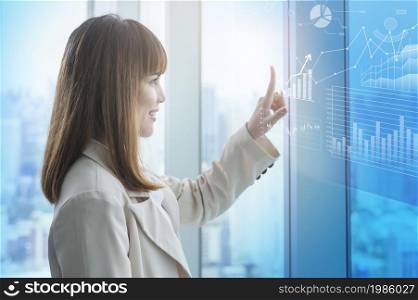 A young business woman hand touching on virtual screen. Young business woman hand touching on virtual screen