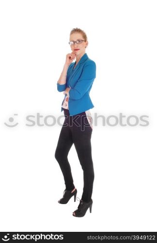 A young business woman in black tights and blue jacket standing in profile isolated for white background.