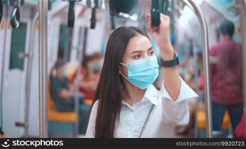 A young business woman is wearing face mask in public transportation , safety travel , covid-19 protection concept. .  A young business woman is wearing face mask in public transportation , safety travel , covid-19 protection concept. 