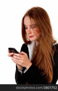 A young business woman texting on her cell phone, with long brunettehair, isolated for white background.