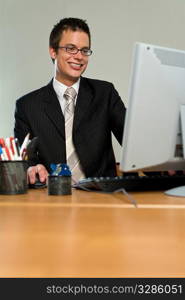 A young businessman at work in the office