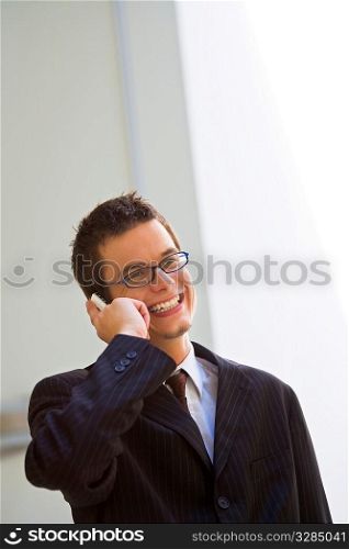A young businessman clinching a deal on his cell phone