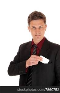 A young businessman potting his business card in his suit pocked,isolated for white background.
