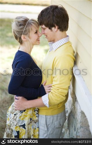 A young caucasian couple in love hugging outdoor