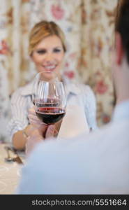 A young couple having dinner at a restaurant