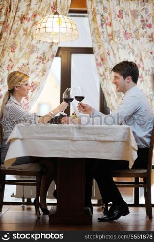 A young couple having romantic dinner at a restaurant