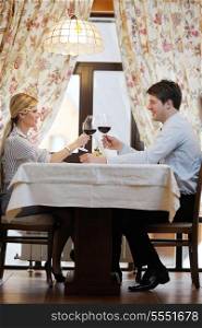 A young couple having romantic dinner at a restaurant