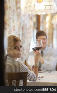 A young couple having romantic dinner at a restaurant