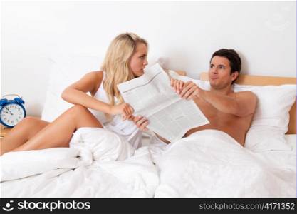 a young couple in bed having problems and crisis. divorce and separation.