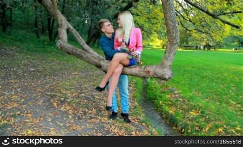 a young couple in the autumn park